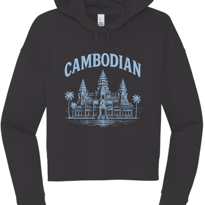 This image features a black, long-sleeved cropped hoodie with a graphic design centered on the chest that celebrates Cambodian heritage.

Design Elements
Garment Style: The hoodie has a modern "cropped" cut that ends near the waistline, featuring dropped shoulders and matching black drawstrings.

Graphic Color: The print is rendered in a light pastel blue, providing a cool contrast against the black fabric.

Illustration: The central image is a detailed depiction of Angkor Wat. This version of the design in