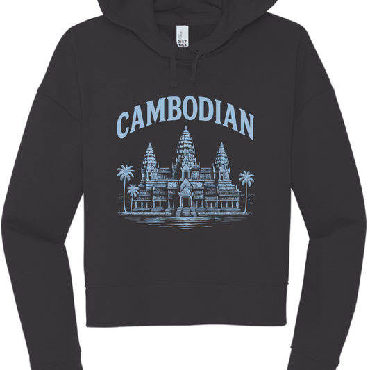 This image features a black, long-sleeved cropped hoodie with a graphic design centered on the chest that celebrates Cambodian heritage.

Design Elements
Garment Style: The hoodie has a modern "cropped" cut that ends near the waistline, featuring dropped shoulders and matching black drawstrings.

Graphic Color: The print is rendered in a light pastel blue, providing a cool contrast against the black fabric.

Illustration: The central image is a detailed depiction of Angkor Wat. This version of the design in