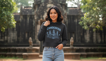 Woman wearing a black sweatshirt with 'Cambodian' text in front of a temple.