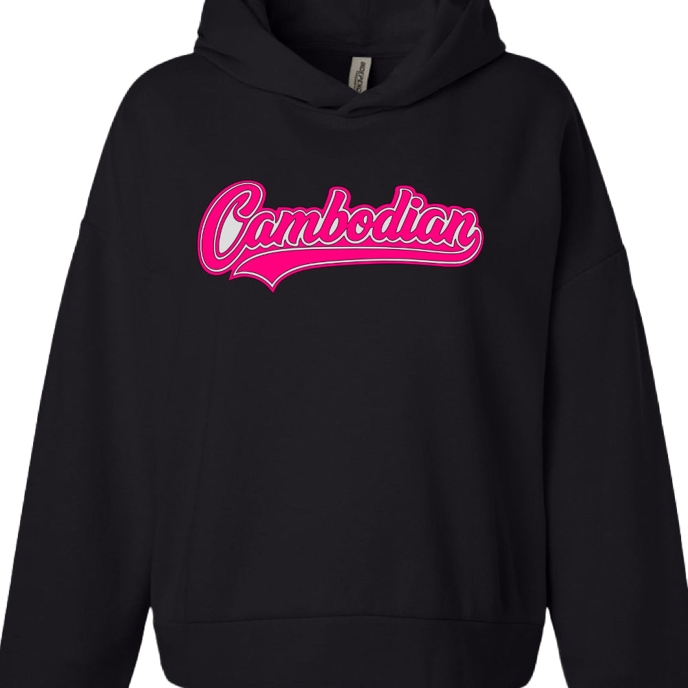 Text Content: The word "Cambodian" is printed centrally on the chest.

Typography: The text uses a script, cursive font with a retro or athletic feel.

Color Palette: The lettering is white, accented with a vibrant pink outline and a matching pink swoosh underline.

Style: The design mimics a classic "varsity" or sports logo aesthetic.