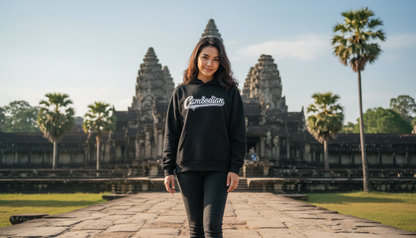 Person standing in front of Angkor Wat with a 'Cambodian' sweatshirt
