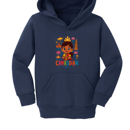 The design is a bright, cartoon-style illustration featuring several cultural motifs:

Central Figure: A young Cambodian girl with a friendly expression. She is wearing a traditional golden crown (similar to those worn by Apsara dancers) and has her hands pressed together in a Sampeah (a traditional Cambodian greeting).

Landmarks: To the left of the girl is a simplified illustration of Angkor Wat, and to the right is a traditional Khmer temple tower or stupa.

Symbols: The background is decorated with colo